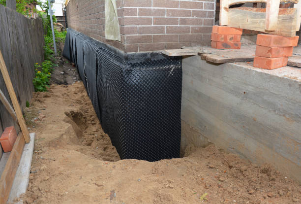 SJ Waterproofing Pros technician performing targeted Waterproofing assessment in Haydenville, OH
